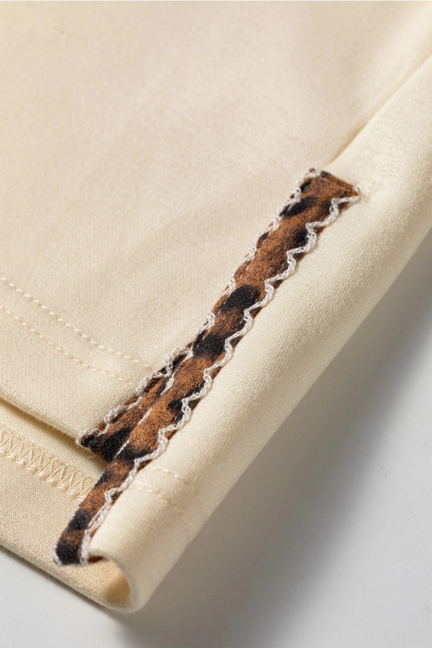 Leopard Trim Split Hem Mock Neck